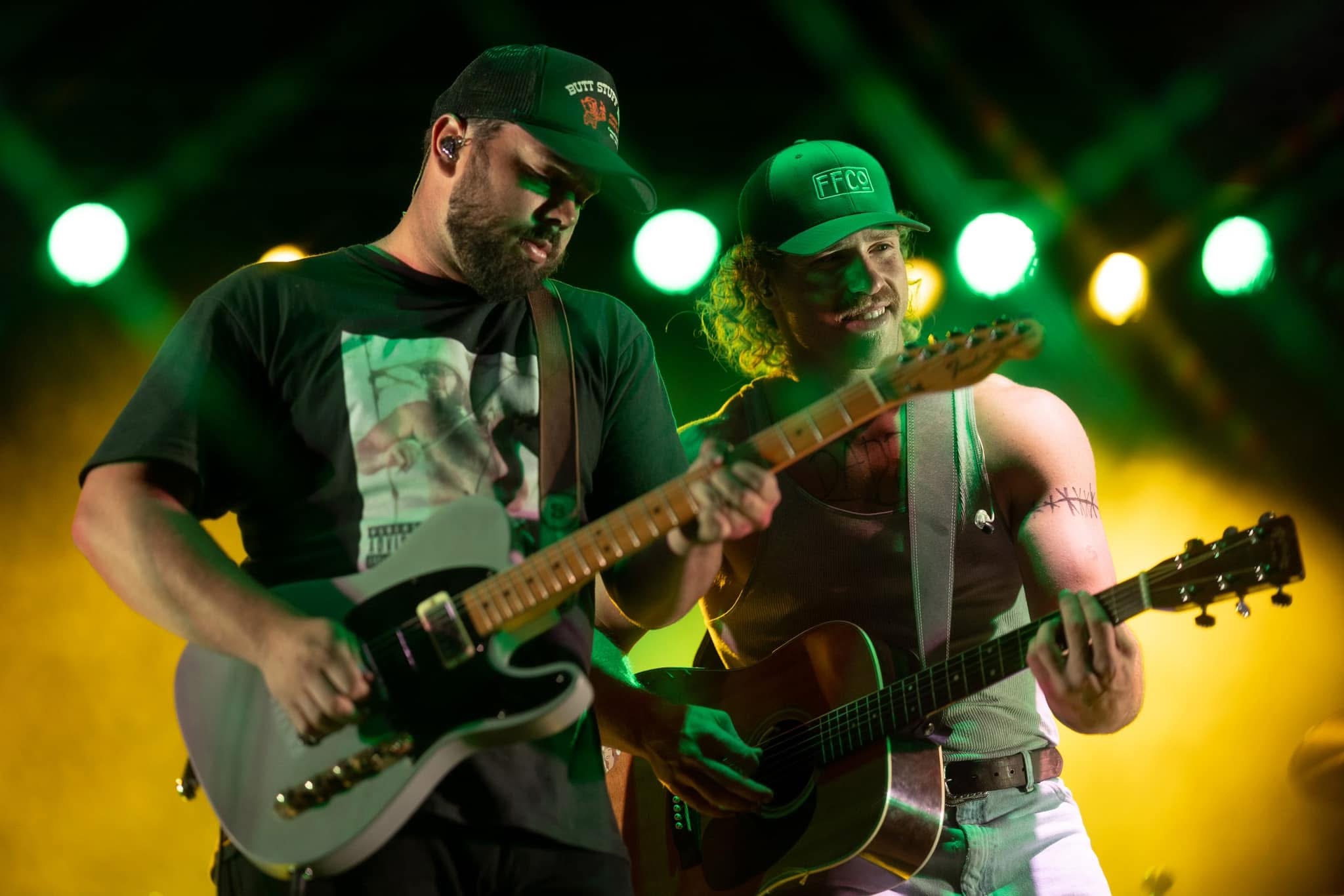 On stage under green concert lights